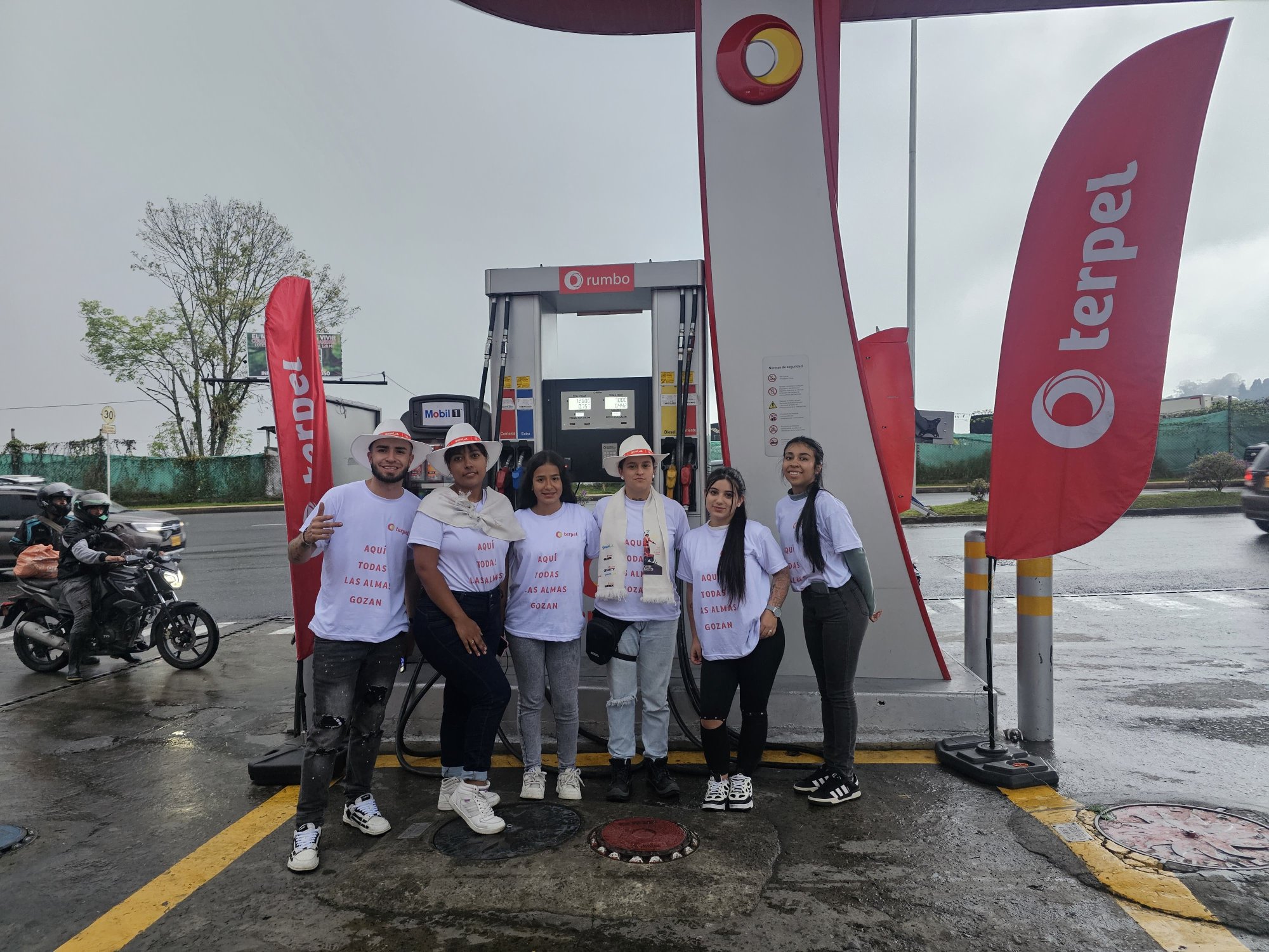 Fuel, Filling station, Fuel dispenser, Gasoline, Logo, Motorcycle, Person, Top — Campañas Pereira Manizales Armenia | Focus Modelos ABTL Agencia BTL Eje Cafetero